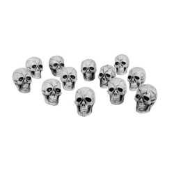 12 Petites têtes de mort plastique